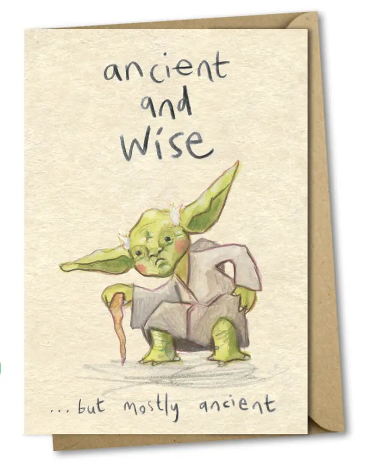 A greetings card with a cream background and an illustration of Yoda - the green Jedi Master - in the middle. He is crouching down using a wooden stick and holding his side. Black handwriting around  the image says 'ancient and wise... but mostly ancient'.
