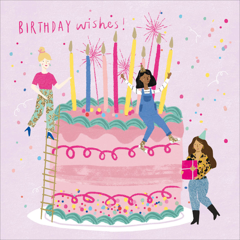 A birthday greetings card with a lilac background and an image of a large cake with women climbing on it.