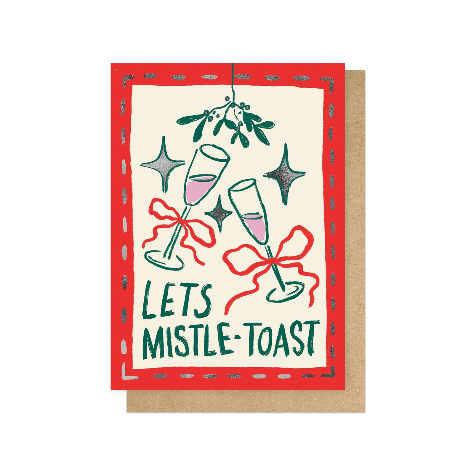A festive greeting card with a red border and the words 'LETS MISTLE-TOAST' in green, featuring illustrated champagne glasses, mistletoe, stars, and red bows, shown with a brown kraft envelope on a white background.