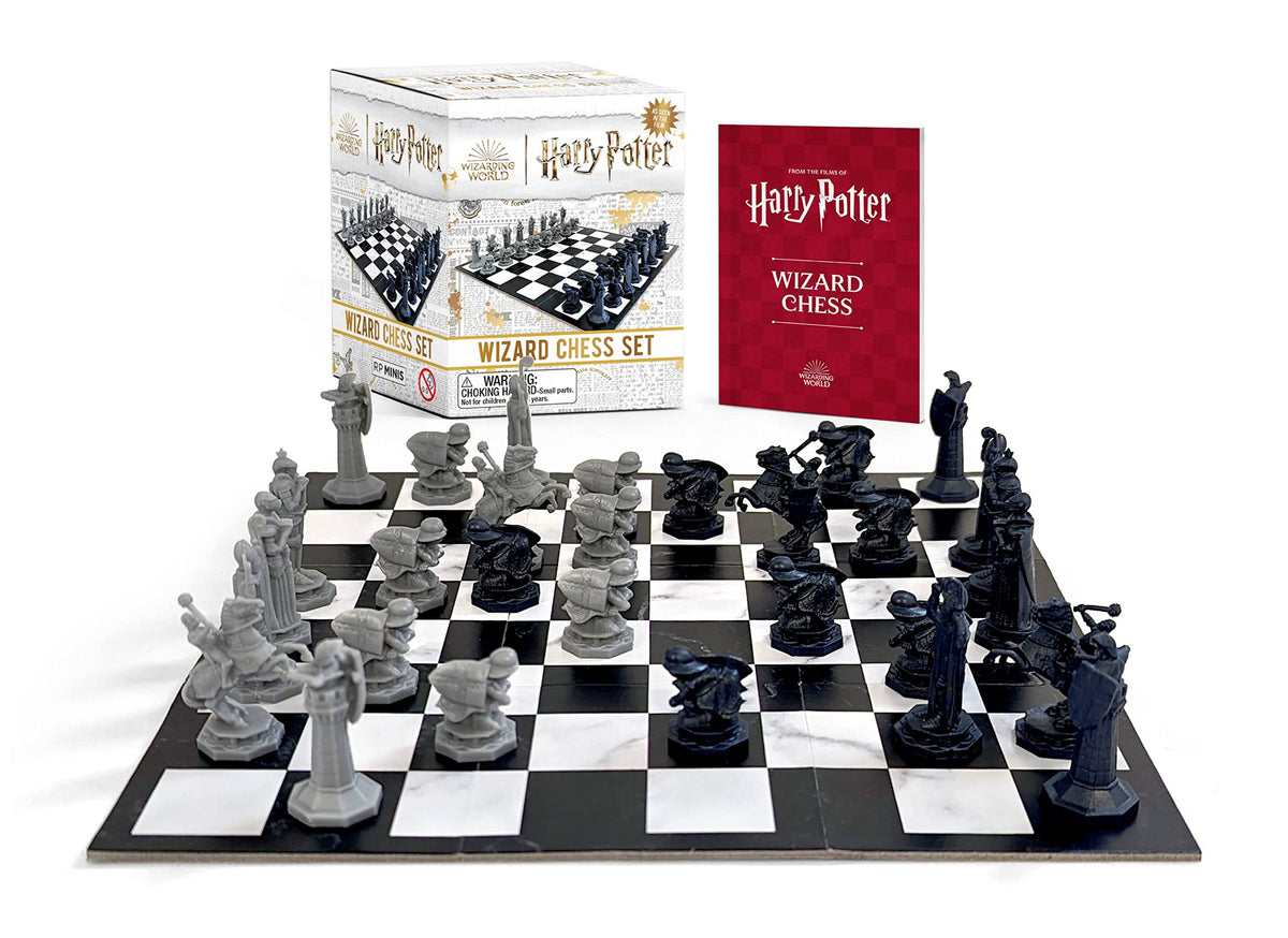 An image of the Harry Potter Wizard Chess Mini Kit by Running Press. It shows the boxed packaging in the background alongside a red booklet. In the foreground is an image of the box contents; a black and white chessboard with grey and black figures.