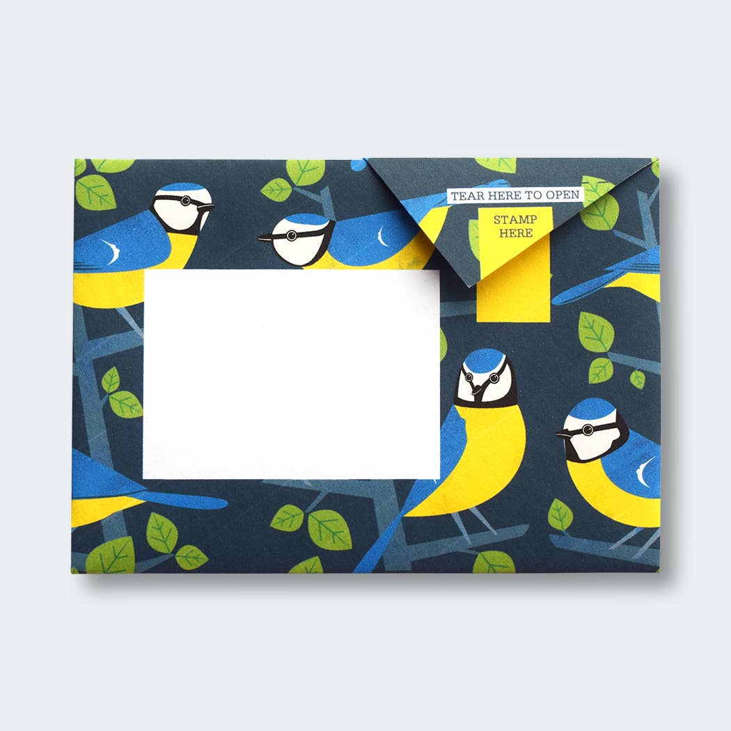 Dawn Chorus Pigeon Folding Letter Set by penny black showing a dark blue folded letter with blue tits in a tree