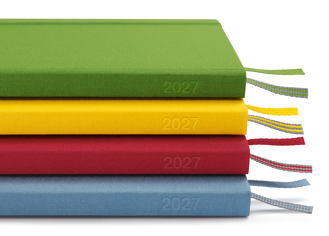 Four colorful seasons leuchtturm1917  2027 planners stacked on a white background