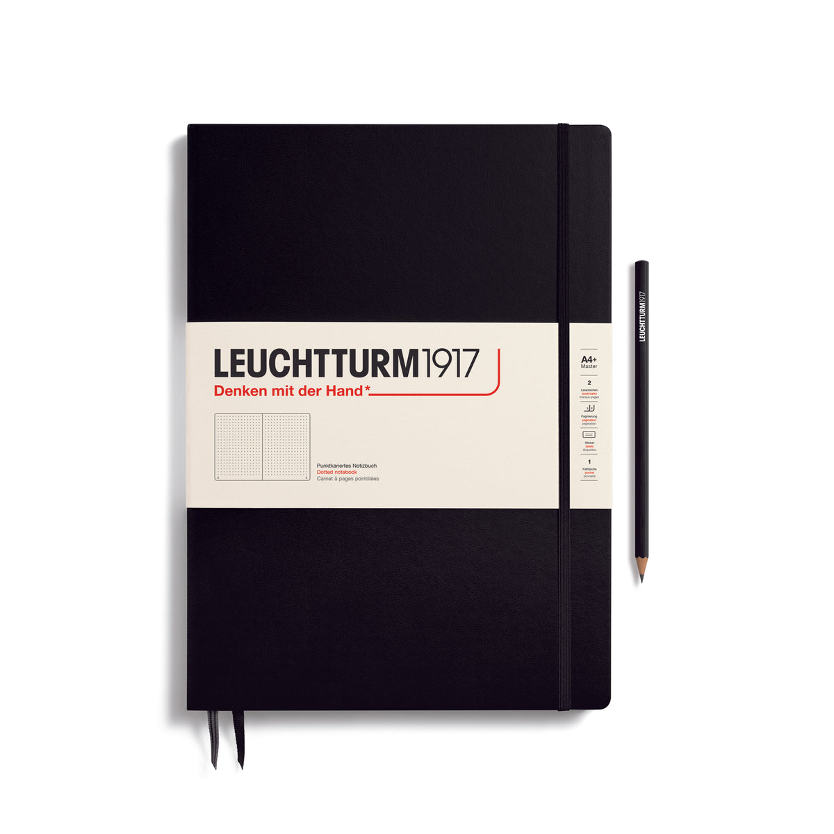A large black notebook with a white paper band around it with the logo of the brand Leuchtturm1917. Below this is an image of the page ruling inside - in this case, dotted. It has two page marker ribbons showing at the bottom near the binding and a matching colour elastic notebook closure holding it neatly together. A black LEUCHTTURM1917 pencil is shown at the side of the book for size reference.