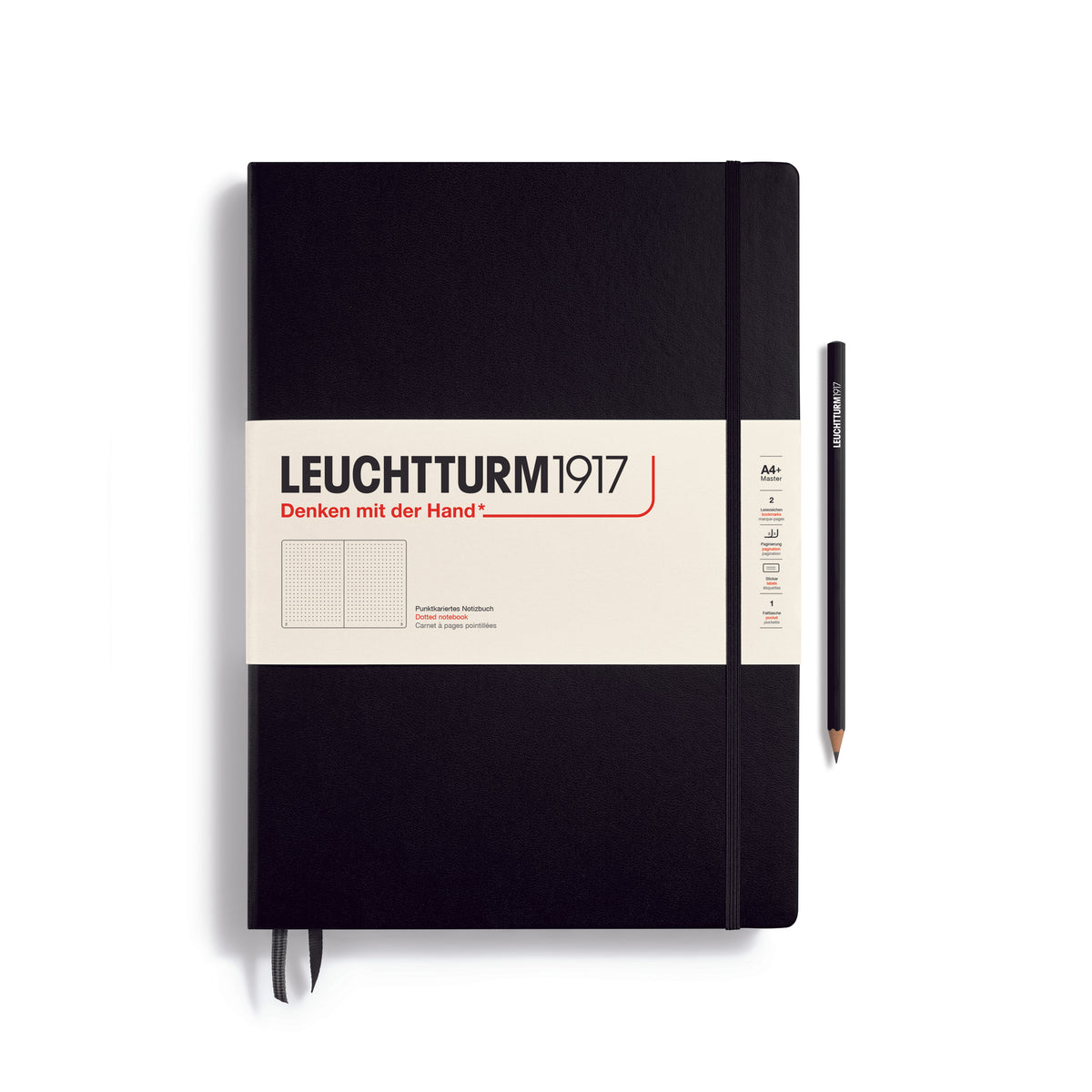 A large black notebook with a white paper band around it with the logo of the brand Leuchtturm1917. Below this is an image of the page ruling inside - in this case, dotted. It has two page marker ribbons showing at the bottom near the binding and an elastic notebook closure holding it neatly together. A black Leuchtturm pencil is shown at the side of the book.