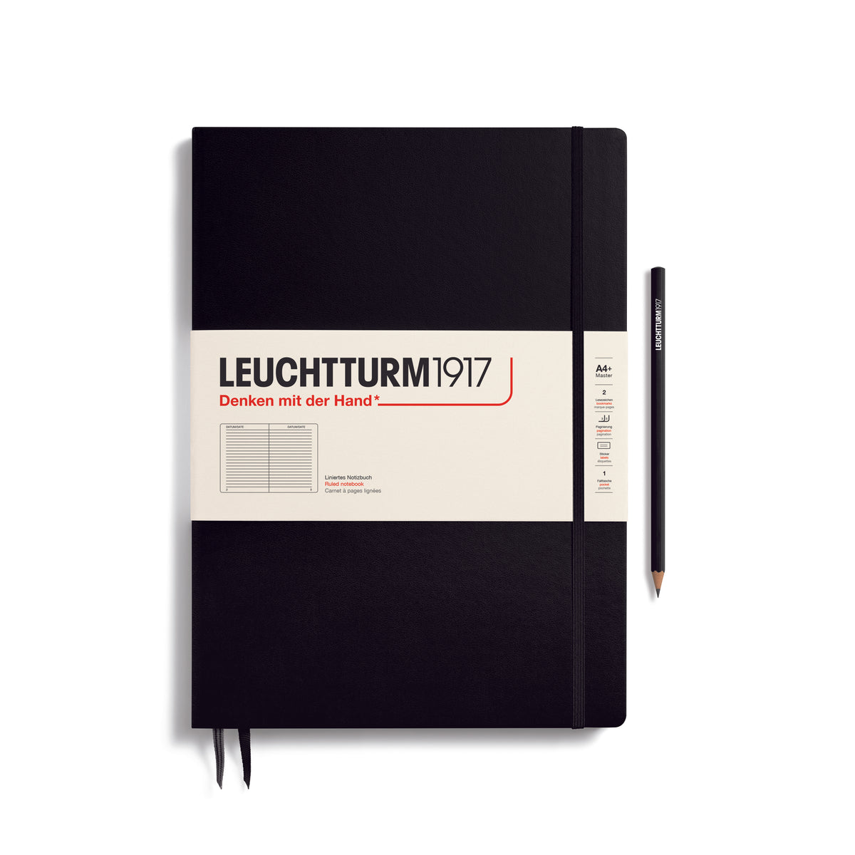 A large black notebook with a white paper band around it with the logo of the brand Leuchtturm1917. Below this is an image of the page ruling inside - in this case, ruled. It has two page marker ribbons showing at the bottom near the binding and a matching colour elastic notebook closure holding it neatly together. A black LEUCHTTURM1917 pencil is shown at the side of the book for size reference.