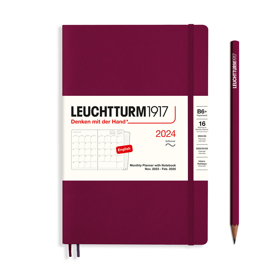 An image of a burgundy planner with a burgundy elastic band holding it together and a cream paper wrap around the middle stating the business name Leuchtturm1917, that it is for the year 2024, it is a monthly planner with notebook, is B6+ in size, soft cover and an English language version. It has an image on the wrap showing the inside layout which is a month across 2 pages. A burgundy pencil is shown at the side of the planner.