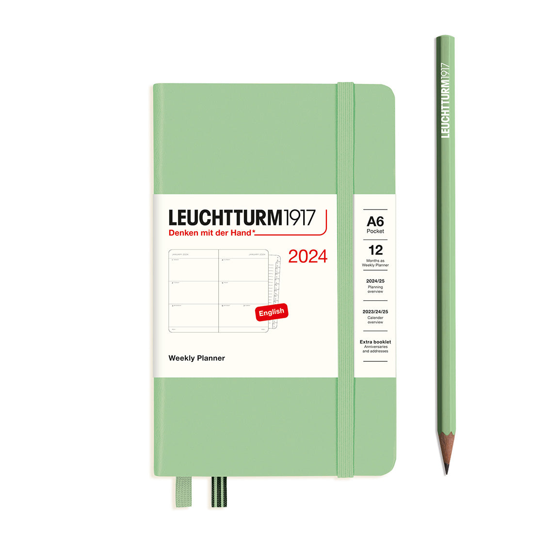 An image of a sage green planner with a sage green elastic band holding it together and a cream paper wrap around the middle stating the business name Leuchtturm1917, that it is for the year 2024, it is a weekly planner, is A6 in size and an English language version. It has an image on the wrap showing the inside layout which is a week spread across 2 pages. A sage green pencil is shown at the side of the planner.