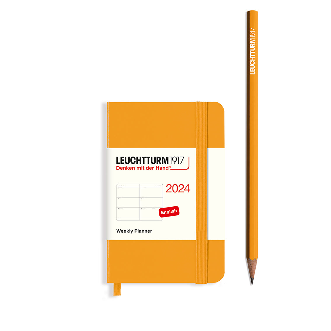 An image of an orange planner with an orange elastic band holding it together and a cream paper wrap around the middle stating the business name Leuchtturm1917, that it is for the year 2024, it is a weekly planner, is A7 in size and an English language version. It has an image on the wrap showing the inside layout which is a week spread across 2 pages. An orange pencil is shown at the side of the planner.
