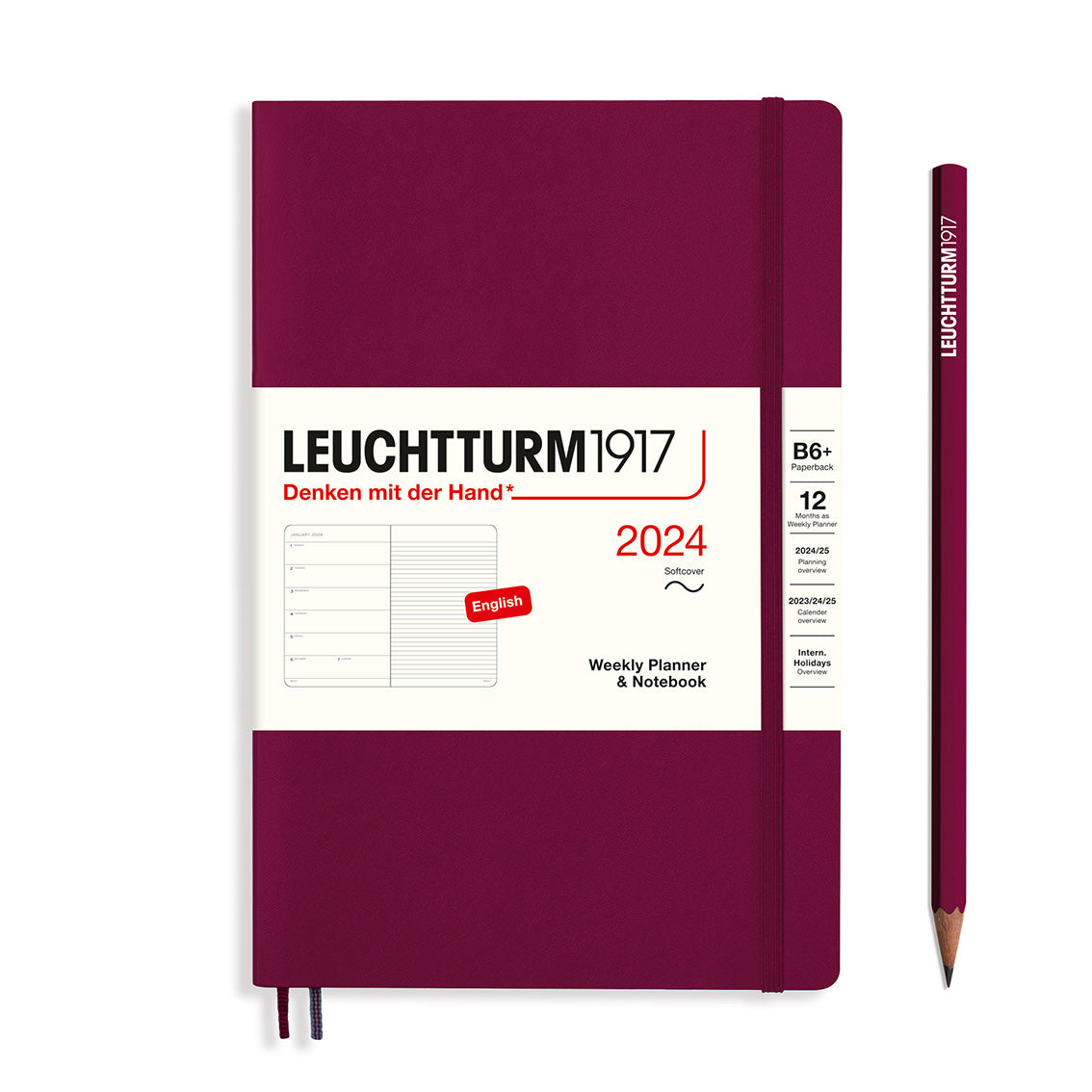 An image of a burgundy planner with a burgundy elastic band holding it together and a cream paper wrap around the middle stating the business name Leuchtturm1917, that it is for the year 2024, it is a weekly planner and notebook, is B6+ in size and an English language version. It has an image on the wrap showing the inside layout which is a week on the left hand page and a notes page on thr right hand page. A burgundy pencil is shown at the side of the planner.