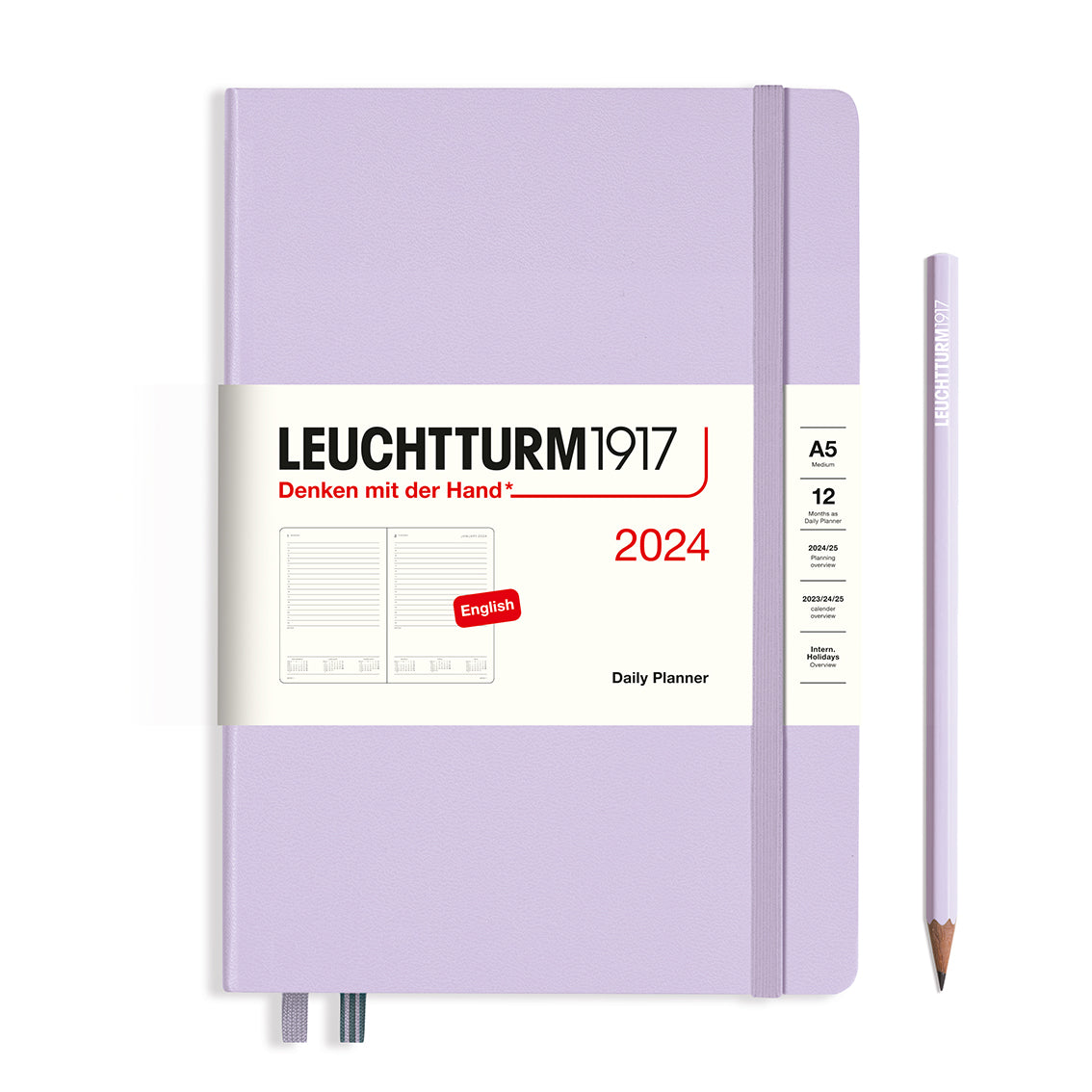 An image of a lilac planner with a lilac elastic band holding it together and a cream paper wrap around the middle stating the business name Leuchtturm1917, that it is for the year 2024, it is a daily planner, is A5 in size and an English language version. It has an image on the wrap showing the inside layout which is 1 day per page. A lilac pencil is shown at the side of the planner.