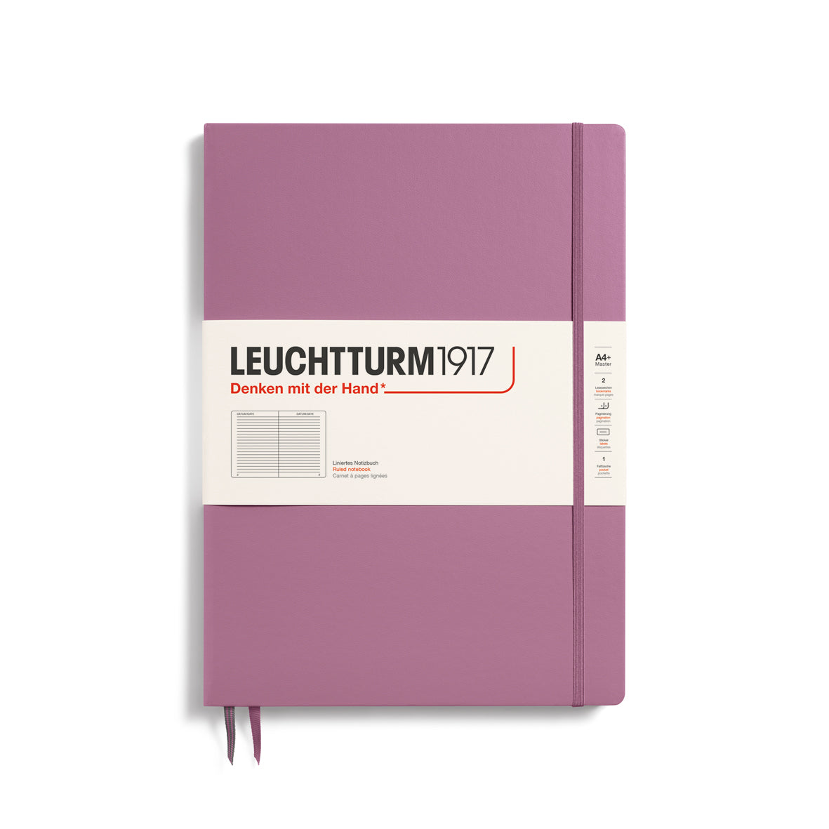 A large dusty rose colour notebook with a white paper band around it with the logo of the brand Leuchtturm1917. Below this is an image of the page ruling inside - in this case, ruled. It has two page marker ribbons showing at the bottom near the binding and a matching colour elastic notebook closure holding it neatly together.