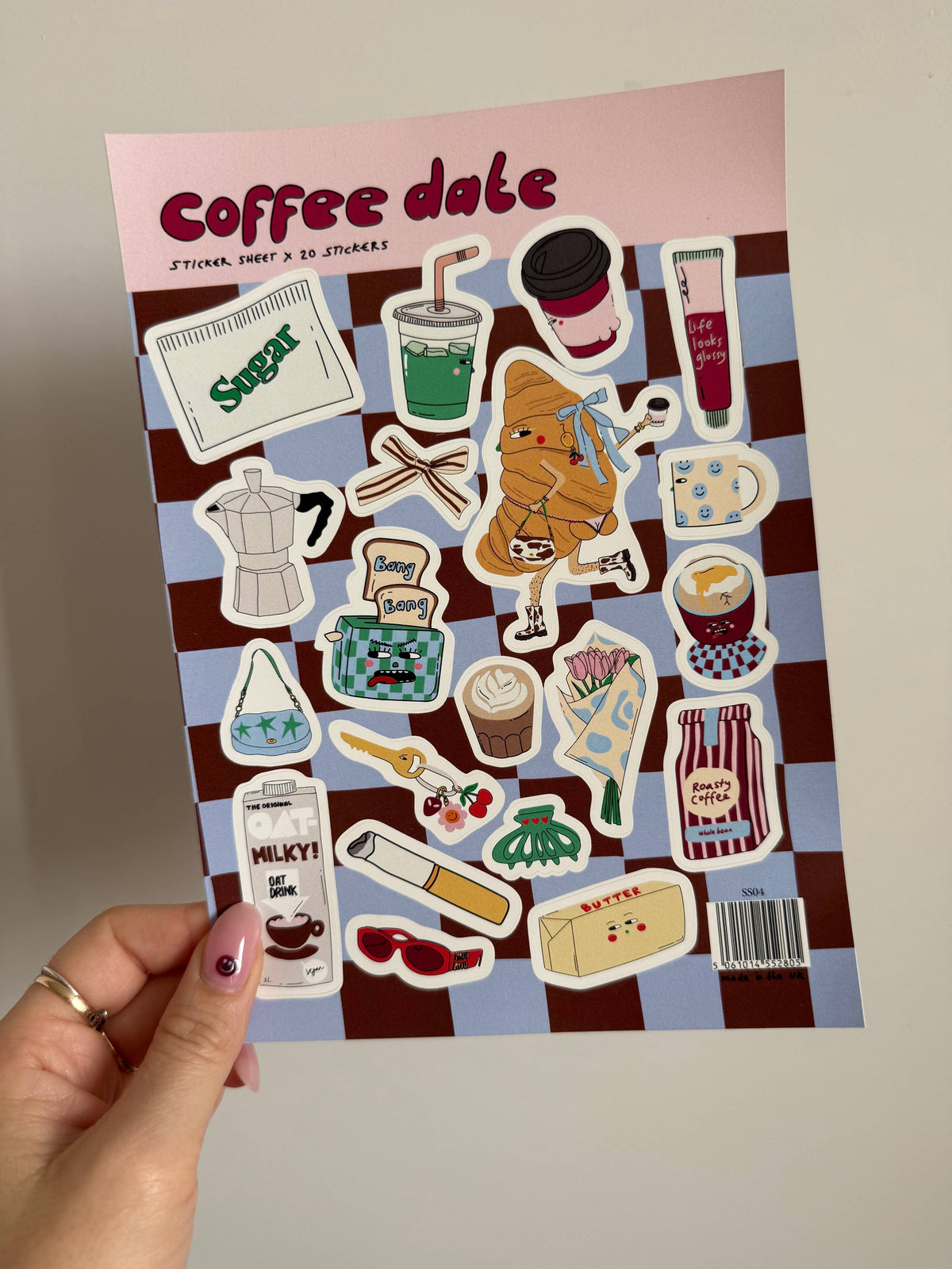 Coffee Date A5 Sticker Sheet - 20 stickers by penny black shown being held