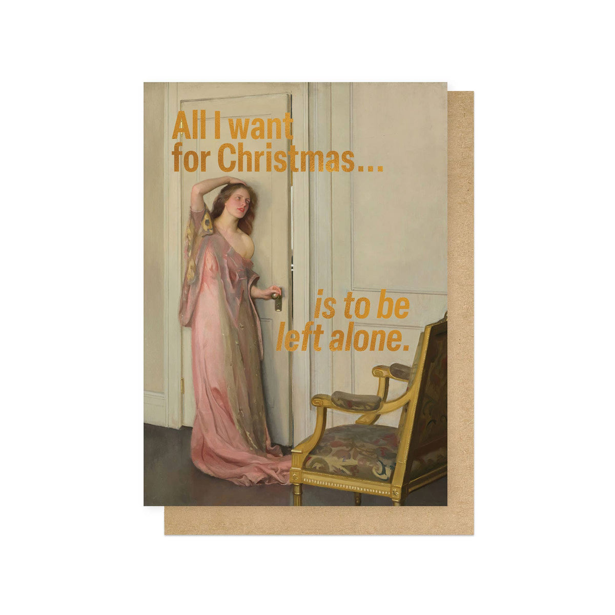 A Christmas card with a vintage-style illustration of a woman in a pink gown standing in a doorway next to a chair, with orange text reading 'All I want for Christmas is to be left alone'.