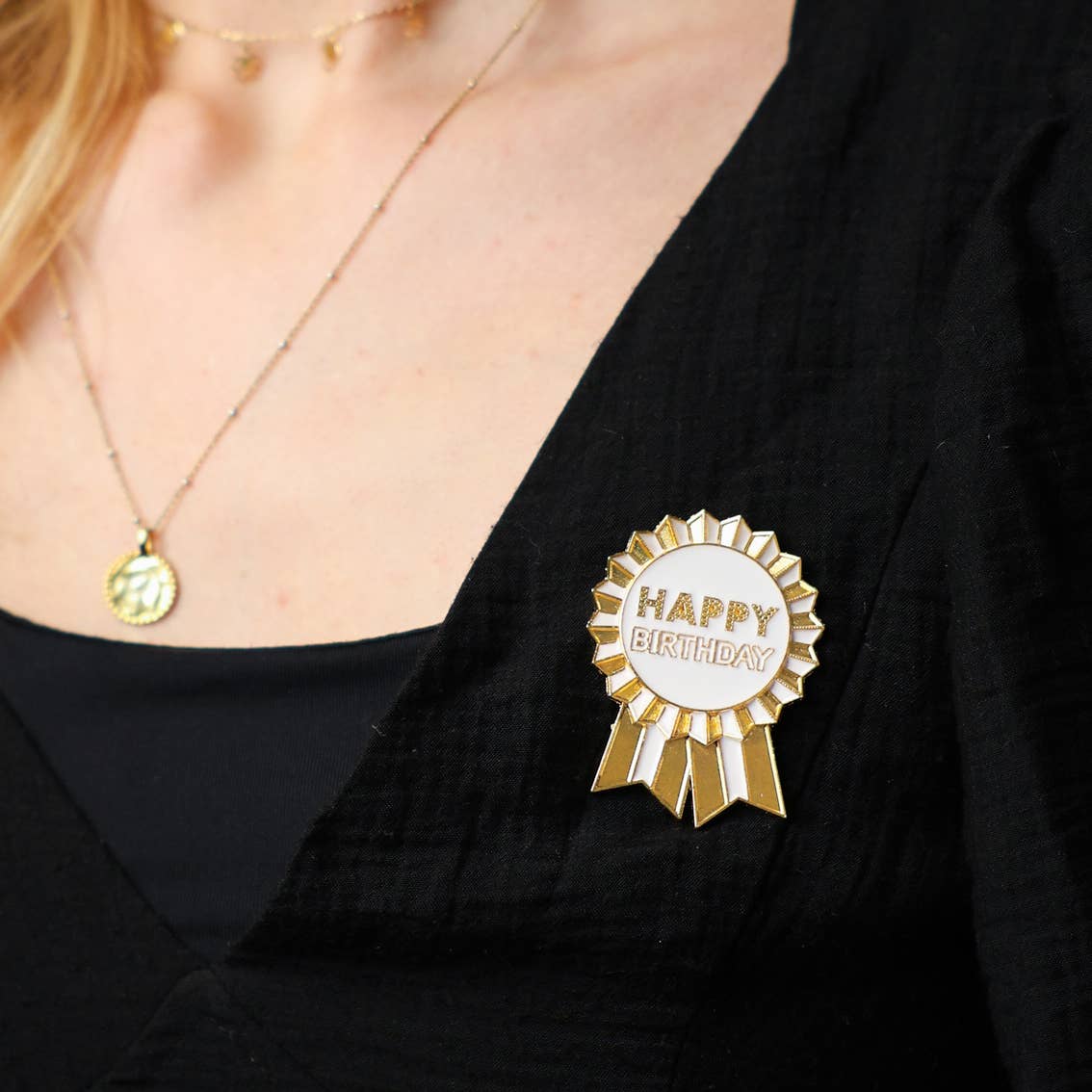 Gold Enamel Happy Birthday Pin Badge on someone&#39;s lapel by penny black