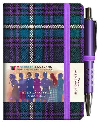 An image of a teal and pruple tartan notebook. It has a purple closure band and a paper belly band explaining the product and brand.