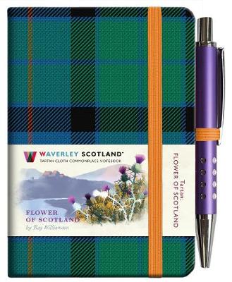 An image of a dark green, black and blue tartan notebook. It has an orange closure band and a paper belly band explaining the product and brand.