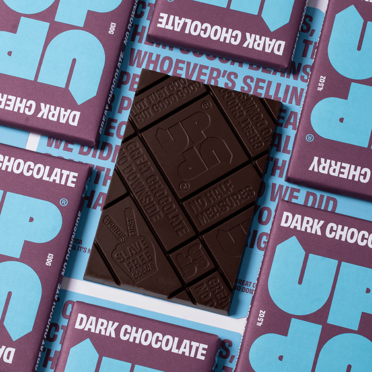 UP-UP Ethical Cherry Dark Chocolate Bar 120g out of the wrapper by penny black