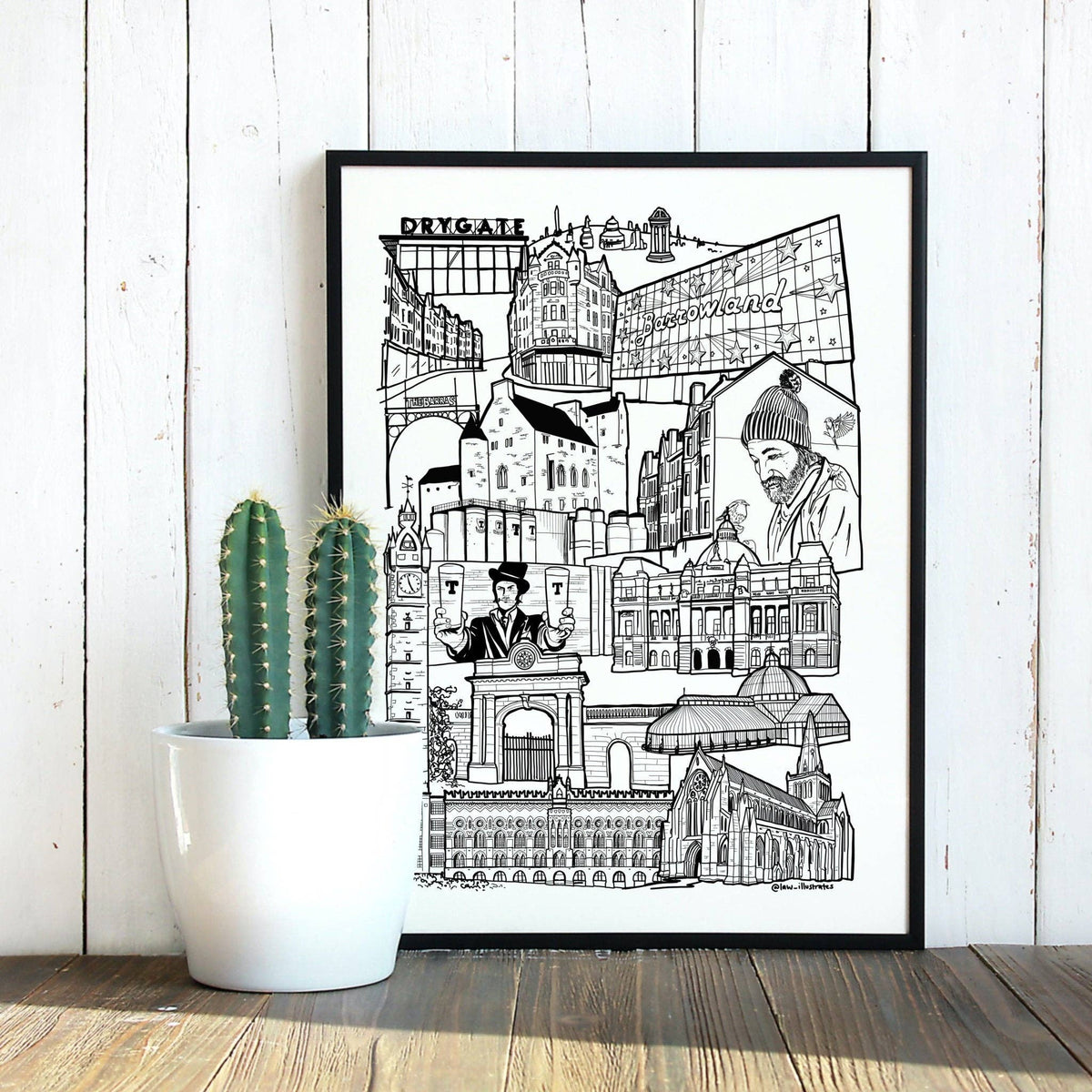 Glasgow East End Landmark Illustration Print by law illustrates at penny black shown in a frame next to a cactus