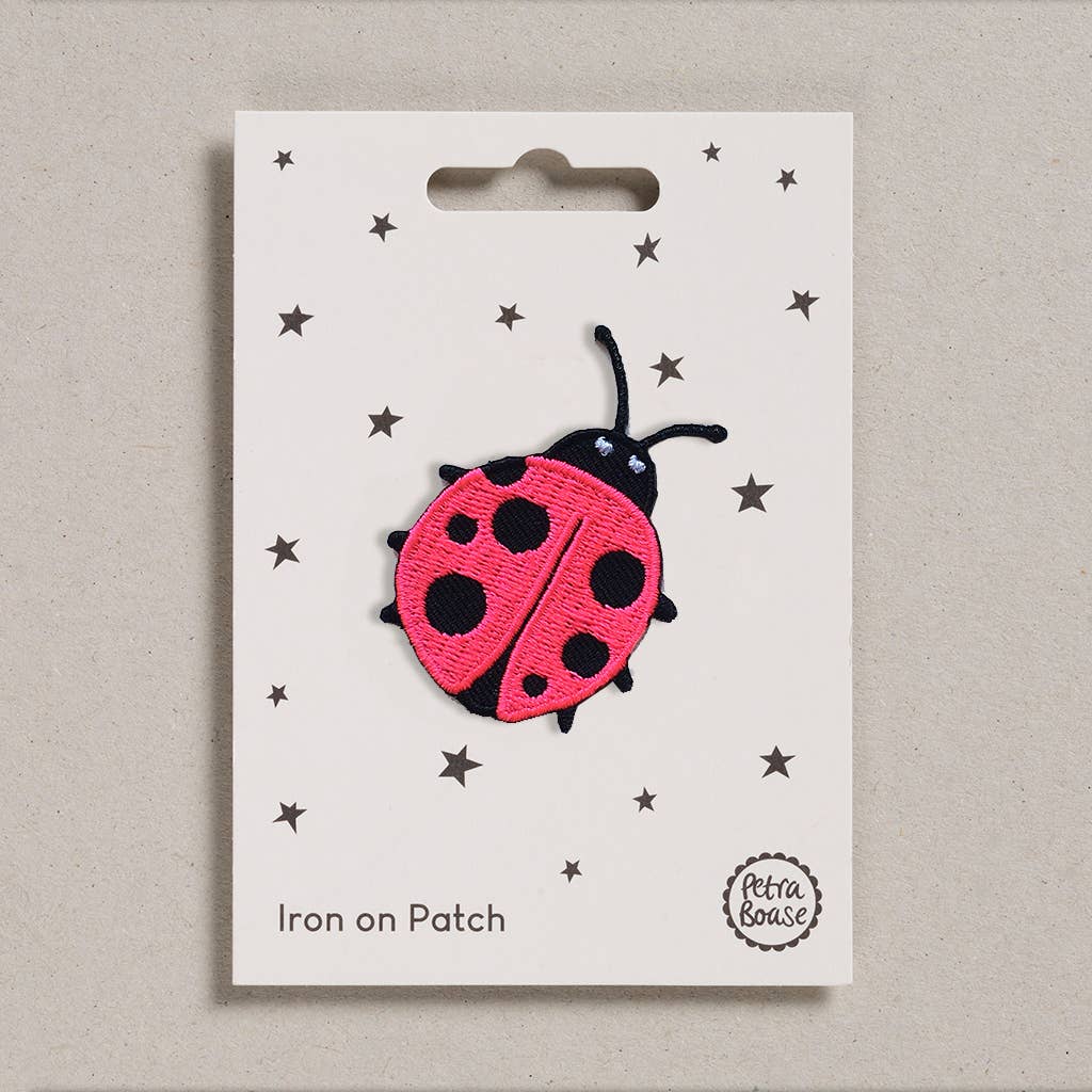 Colourful Iron on Patch - Ladybird on it's backing card at penny black