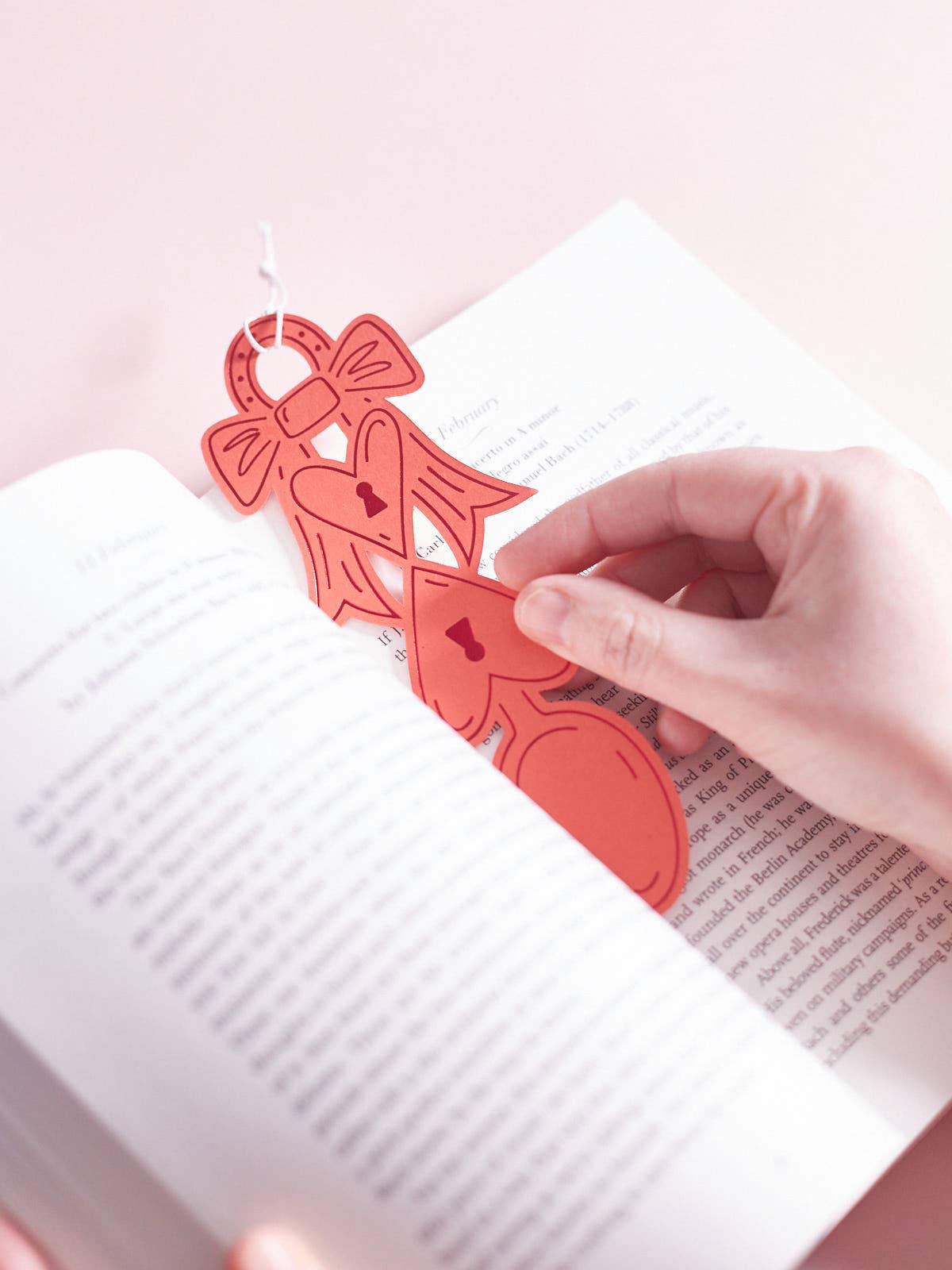 Love Spoon Token Tag Bookmark by penny black shown being used as a bookmark