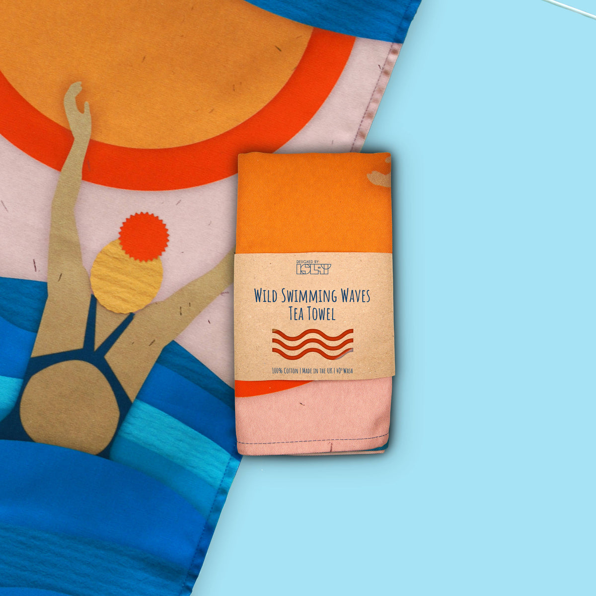 Sea & Wave Collage Wild Swimming Tea Towel shown in packaging by penny black