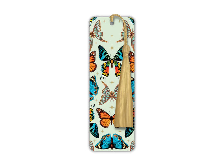 A long rectangular shaped bookmark with long gold tassel. The design on the bookmark has a light green background and is covered in cutout of different types of butterflies. There are holographic stars inbetween.