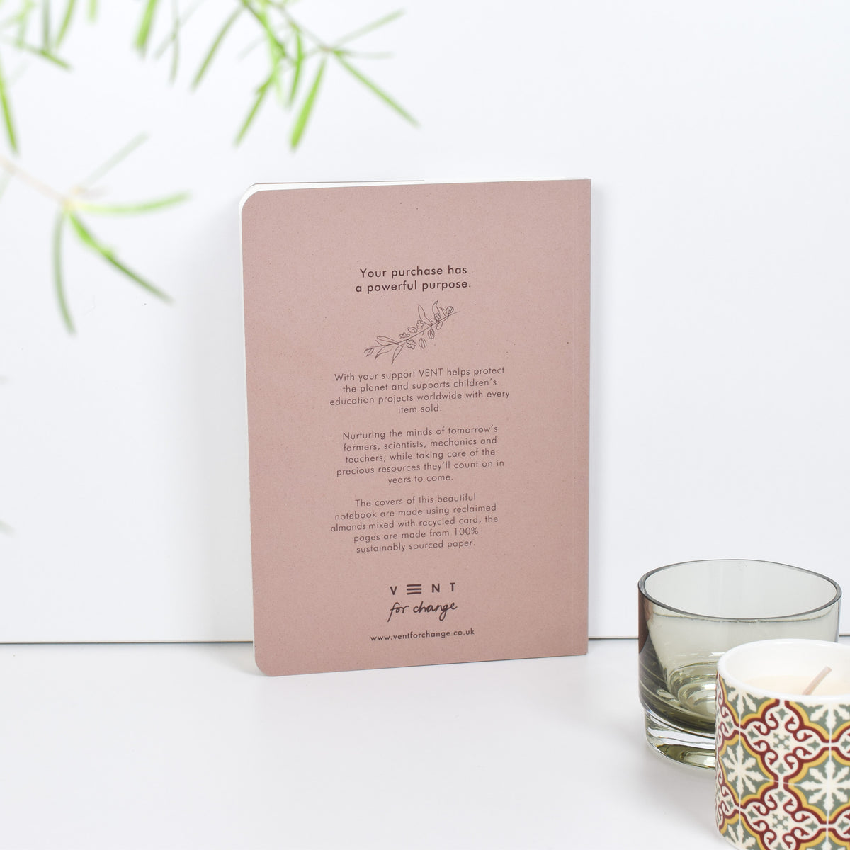 Environotes A5 Lined Notebook - almond notes back cover with writing on it leaning against a white background by Vent For Change at penny black