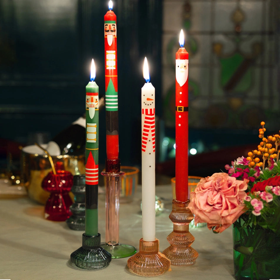Nutcracker Character Christmas Dinner Candles 2 Pk by penny black - showing 4 christmas candles burning on a table