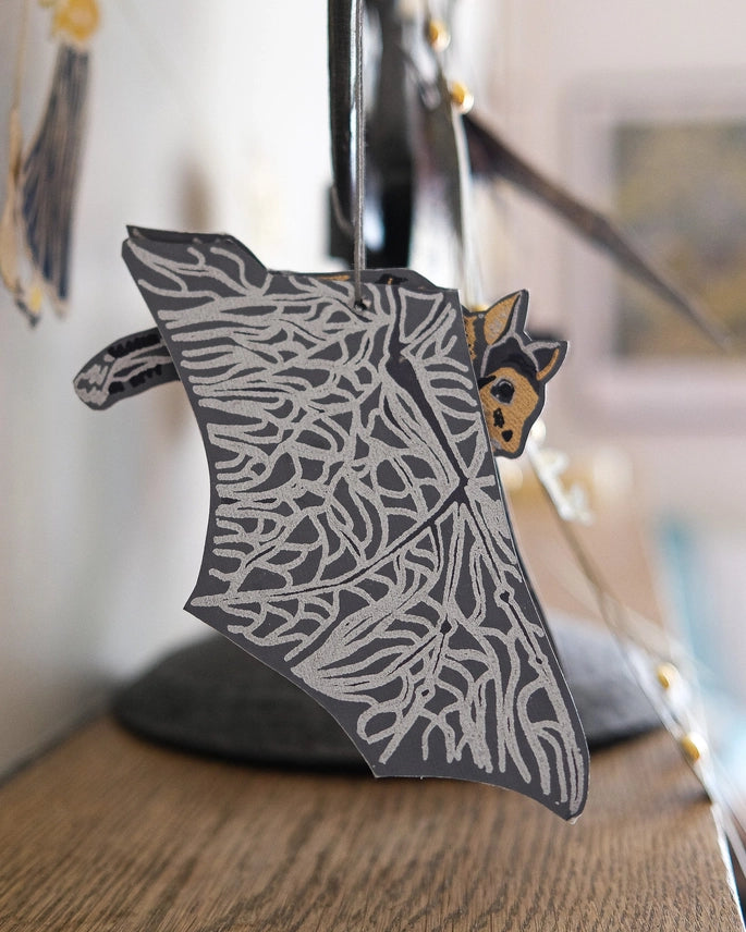 Bats 3D Screen Printed Paper Decorations hanging on a mantlepiece by east end press at penny black