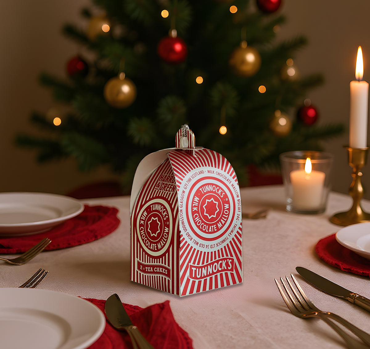 Tunnock's Tea Cake Christmas Bauble by penny black - sitting on table at christmas dinner