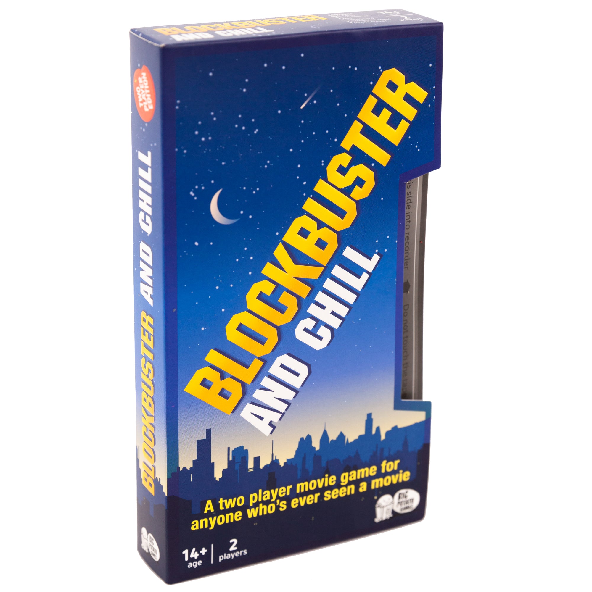 A board game packaged in a VHS tape sleeve. The sleeve shows a nighttime city skyline and big yellow block capitals saying 'BLOCKBUSTER AND CHILL'. Below this is smaller writing stating 'a two player movie game for anyone who's ever seen a movie'.