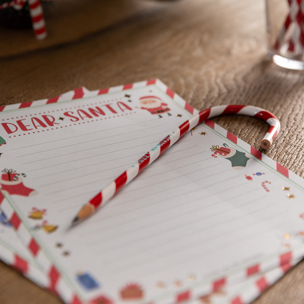 Candy Cane Shape Christmas Pencil by legami at penny black shown on top of a christmas letter