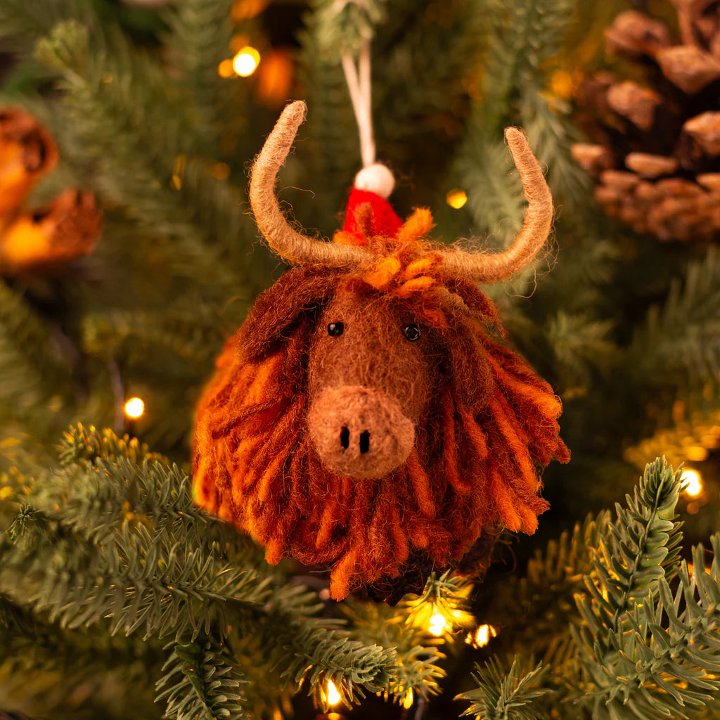 Christmas Highland Cow Wool Felt Handmade Hanging Decoration by penny black shown on a christmas tree