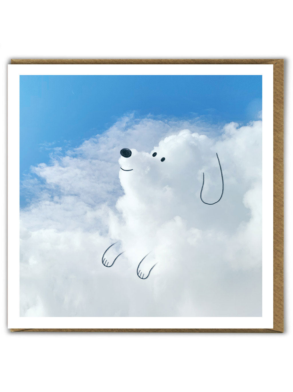 A greetings card showing a cloudy sky where the clouds have been made to look like a happy dog using a black pen.