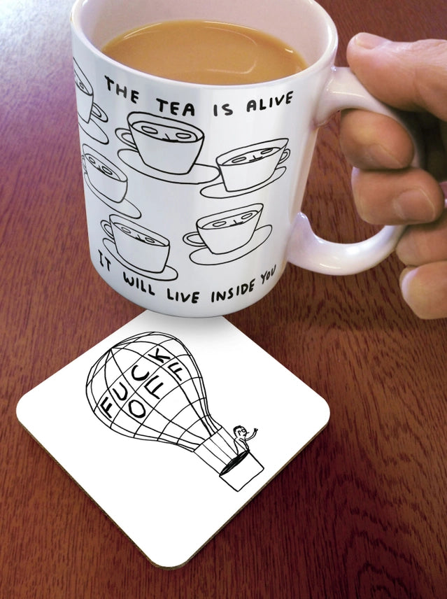 Fuck Off Balloon David Shrigley Coaster on a table by penny black