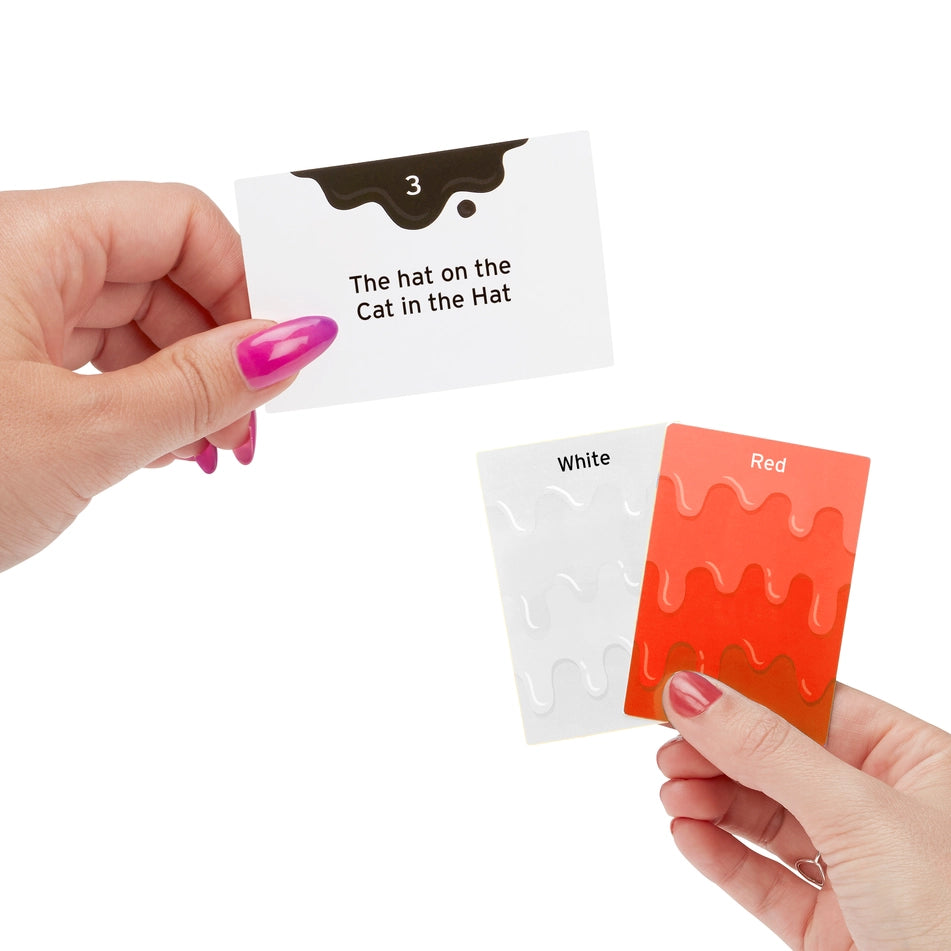 Hand holding a card with text and two colour swatch cards on a white background
