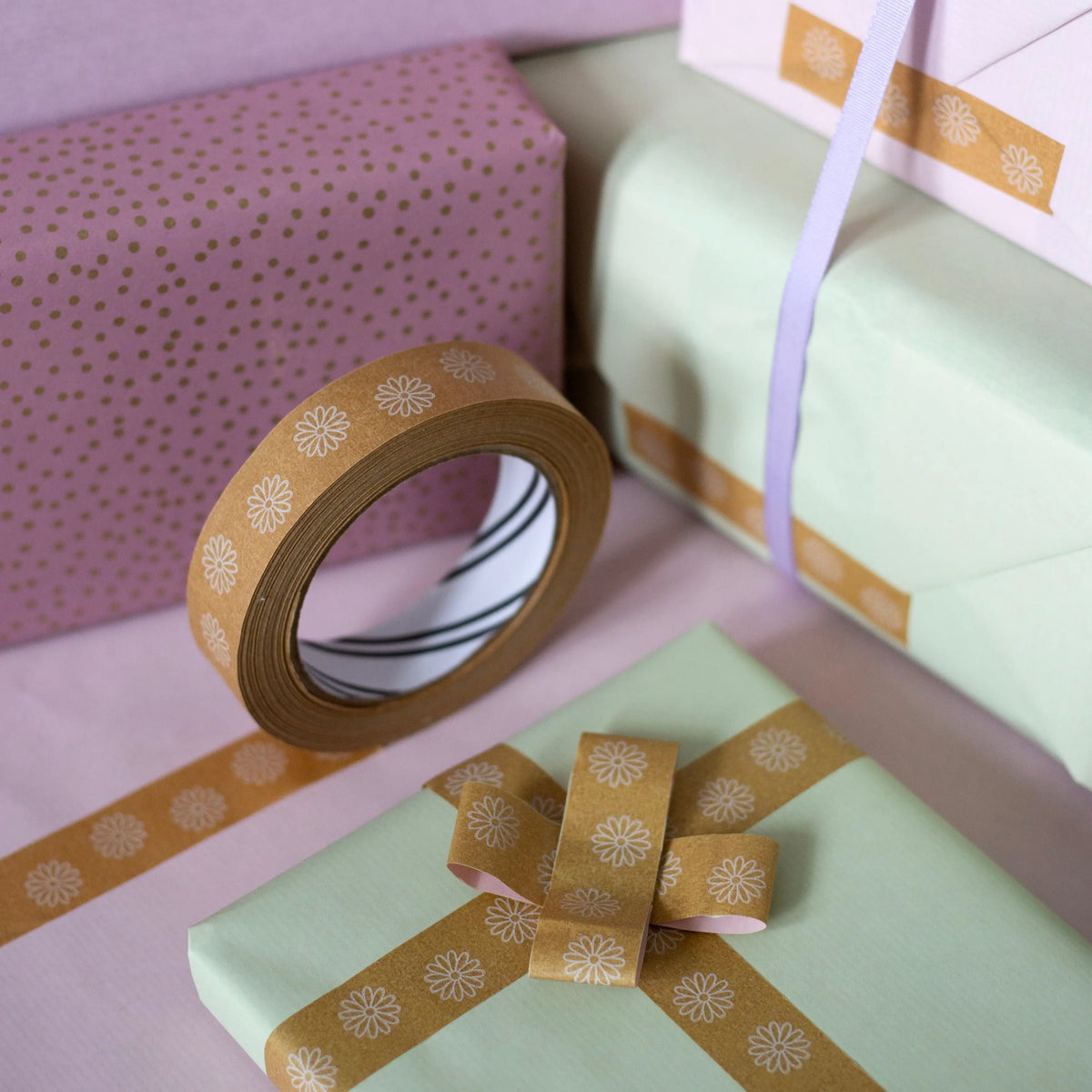 Flower Print Eco Friendly Paper Packaging Tape 24mm x 50m by penny black shown being used to wrap gifts