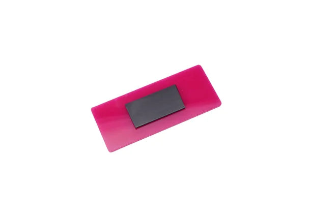 An image of the back of a pink magnet.