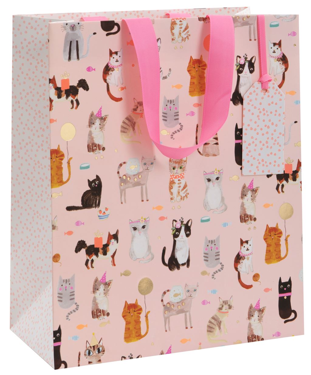 A gift bag with a light pink background covered in illustrations of cats - some with party hats, balloons and gifts. The sides and tag of the bag have a white background and small pink spots. There is a cerise pink ribbon handle.