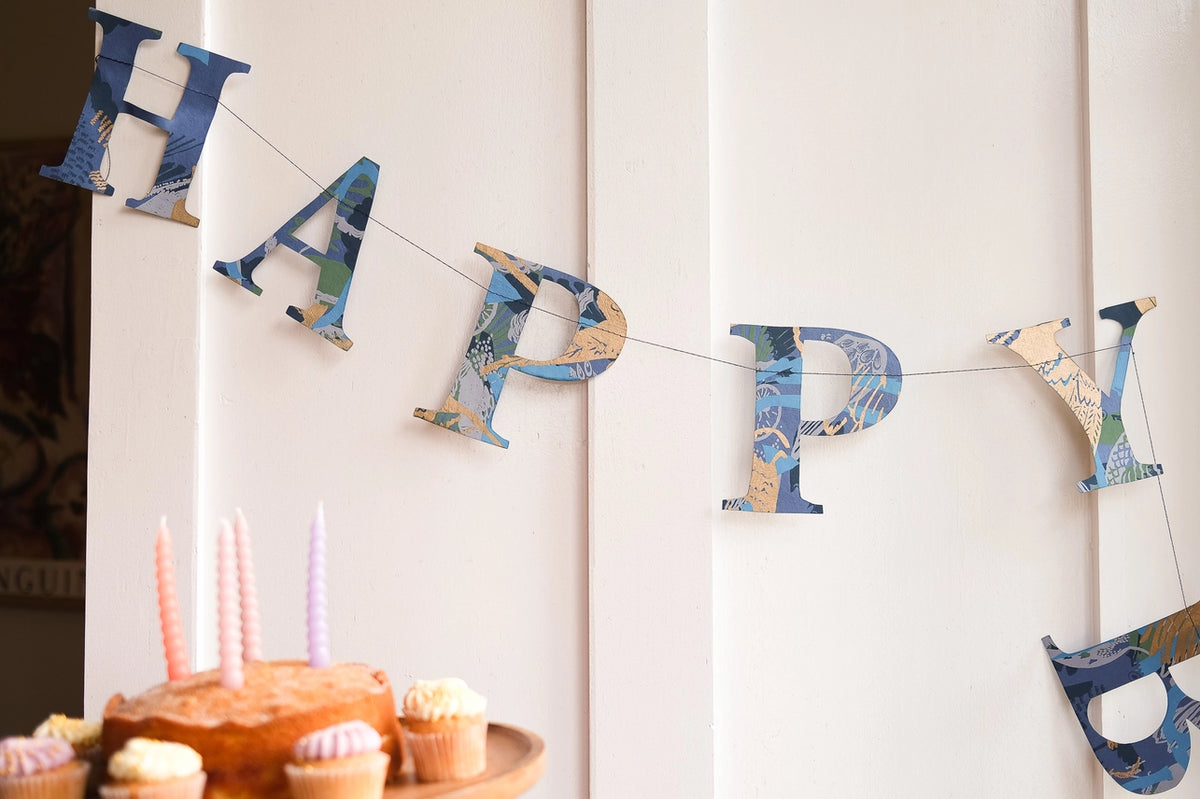 Blue Happy Birthday Screen Printed Paper Garland hanging up by penny black