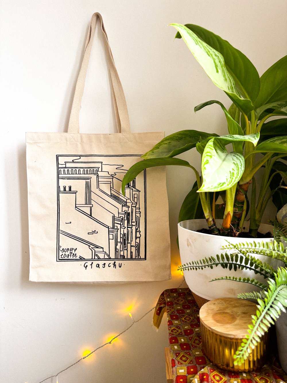 Alba Glaschu Scottish Illustrated Tote Bag by sophy Louise illustration at penny black - Glaschu side in a living room