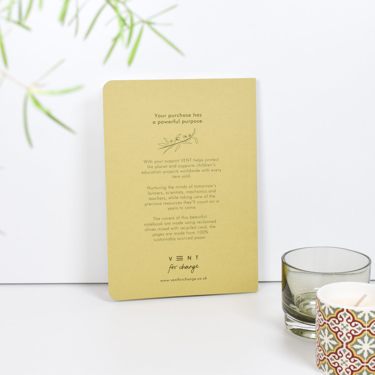 Environotes A5 Lined Notebook - olive notes back cover with writing on it leaning against a white background by Vent For Change at penny black
