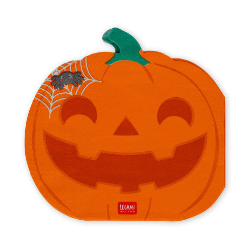 An orange jack-o'-lantern shaped napkin with a green stem, featuring a carved face, a spider on a web in the upper left, and a small red Legami Design logo at the bottom.
