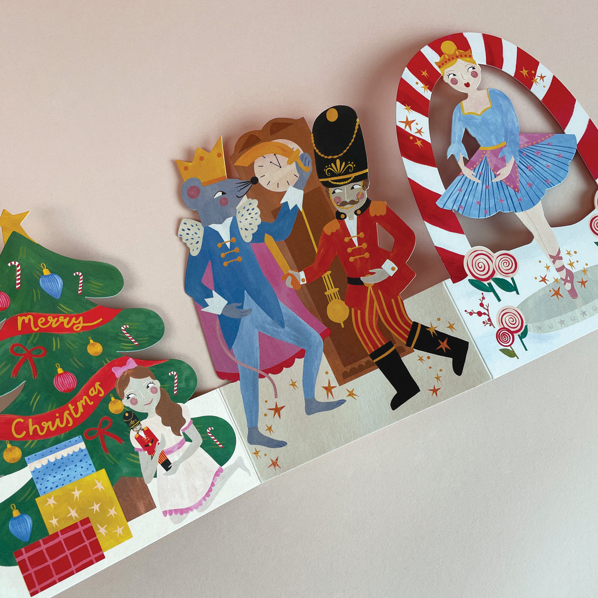 a close up of A 3D fold out christmas card featuring a scene from the nutcracker.