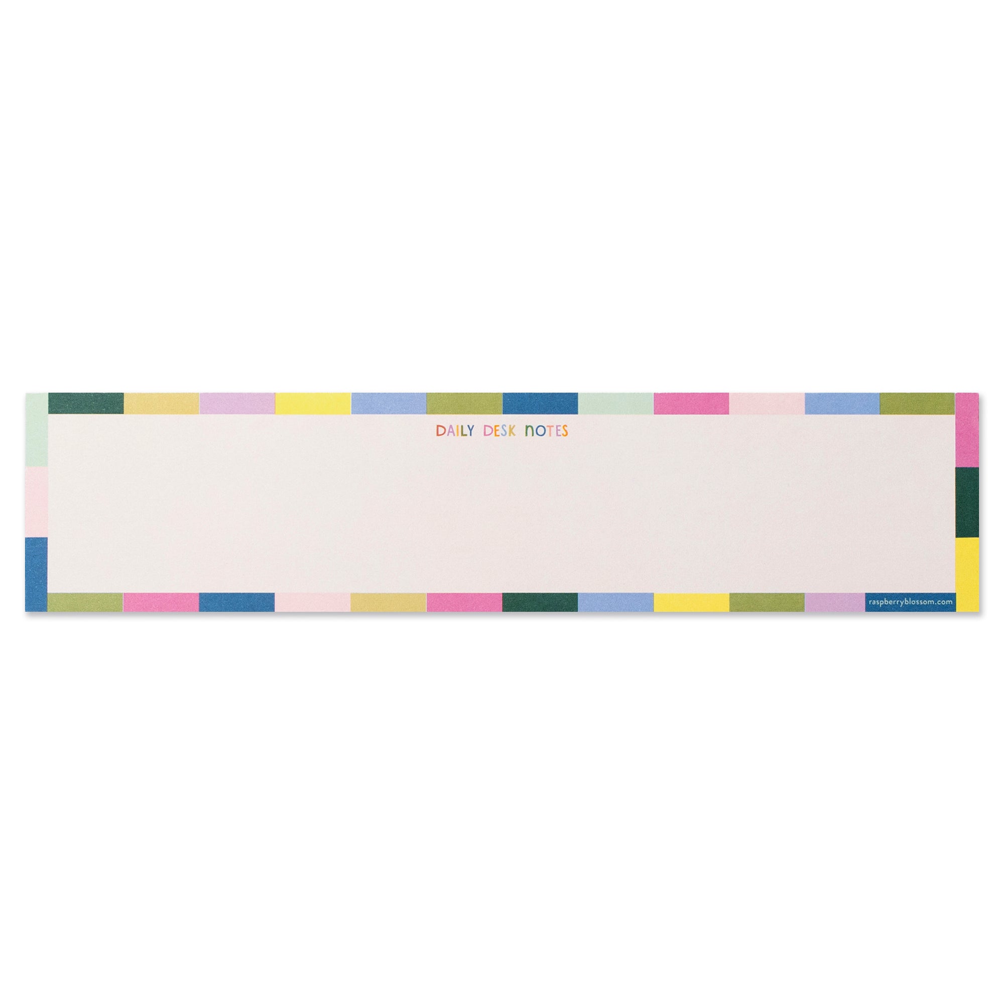 An oblong notepad that is a light cream in colour with a colourblocked outline around the outside of the pad. It says in small multicoloured block capitals 'Daily Desk Notes'.