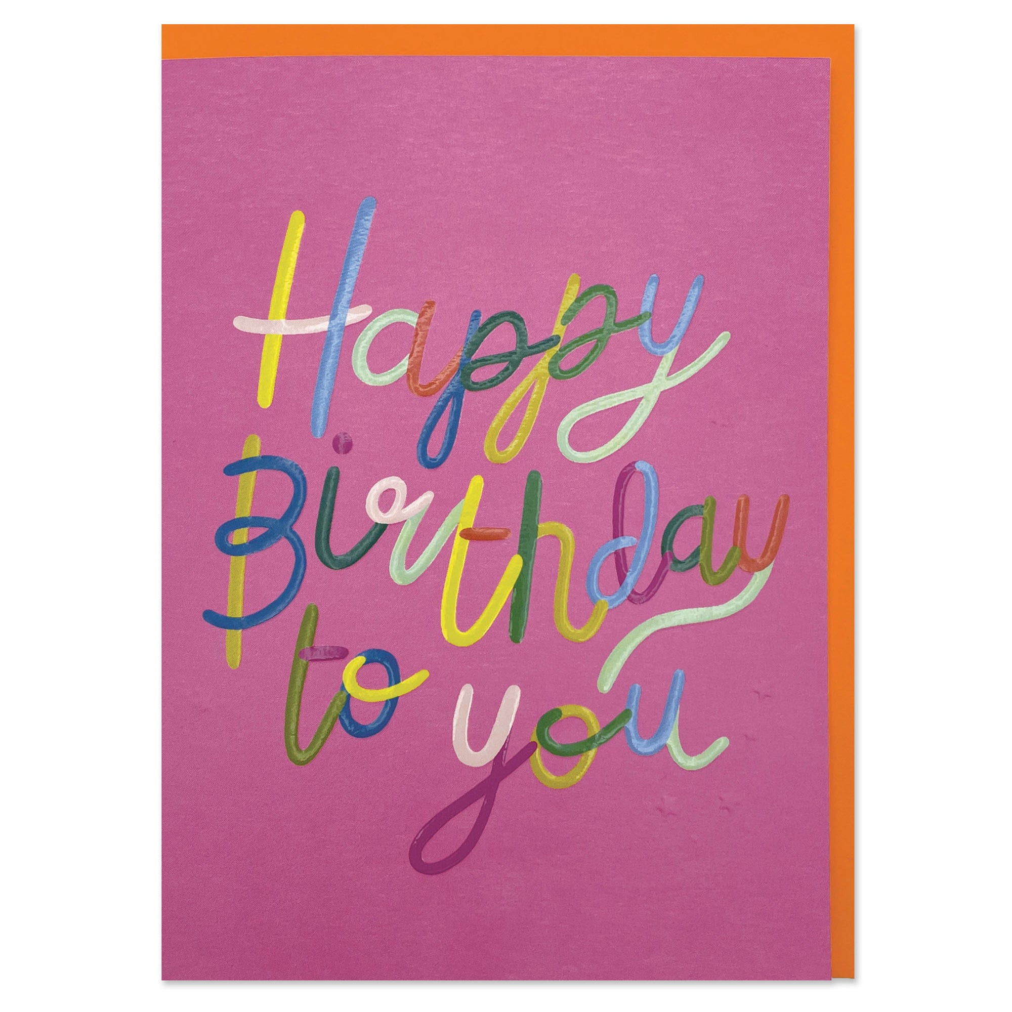 A colourful greetings card to celebrate a birthday where the main colour is hot pink. The wording on the card is 'Happy Birthday to you' in big cursive style wrting. Each part of each letter is a different colour.