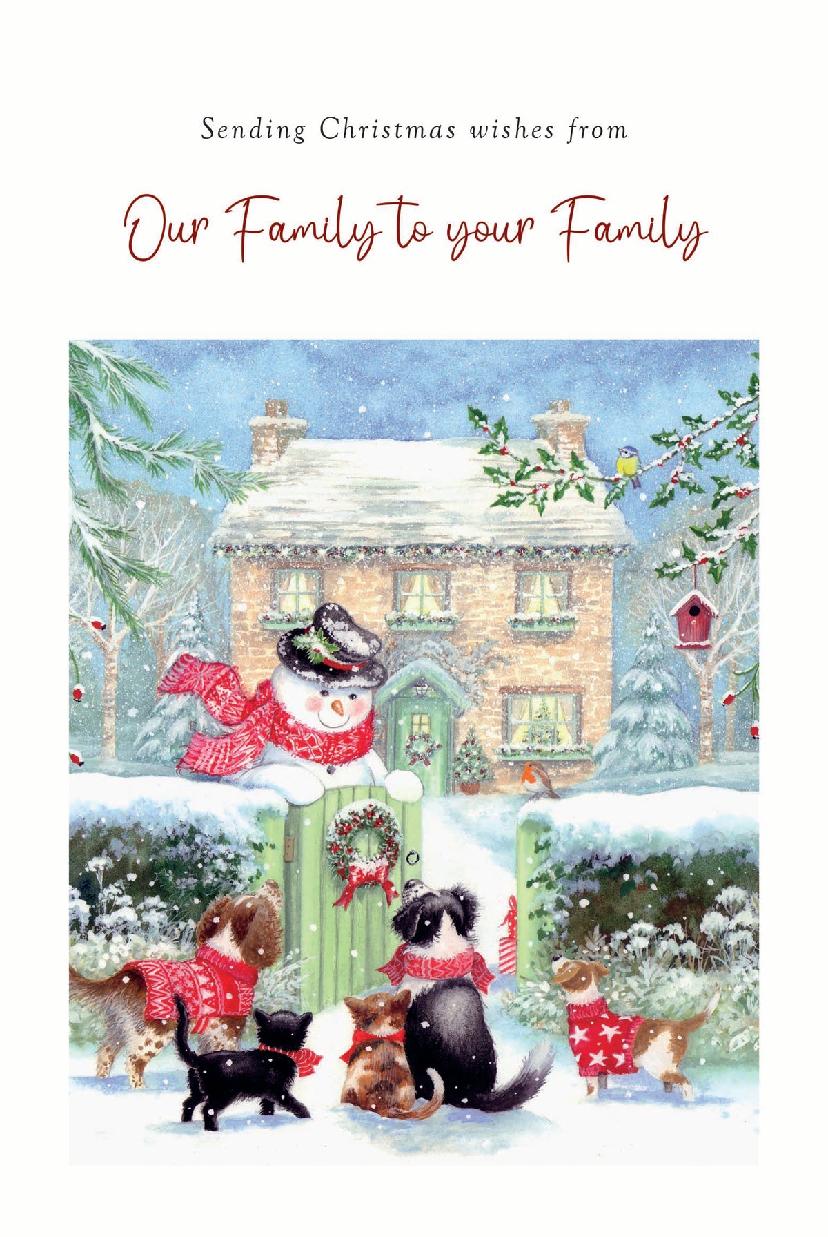 A Christmas greeting card featuring a snowy winter scene with a house, snowman, birds, and several dogs wearing red scarves and sweaters. The top text reads, 'Sending Christmas wishes from Our Family to your Family.