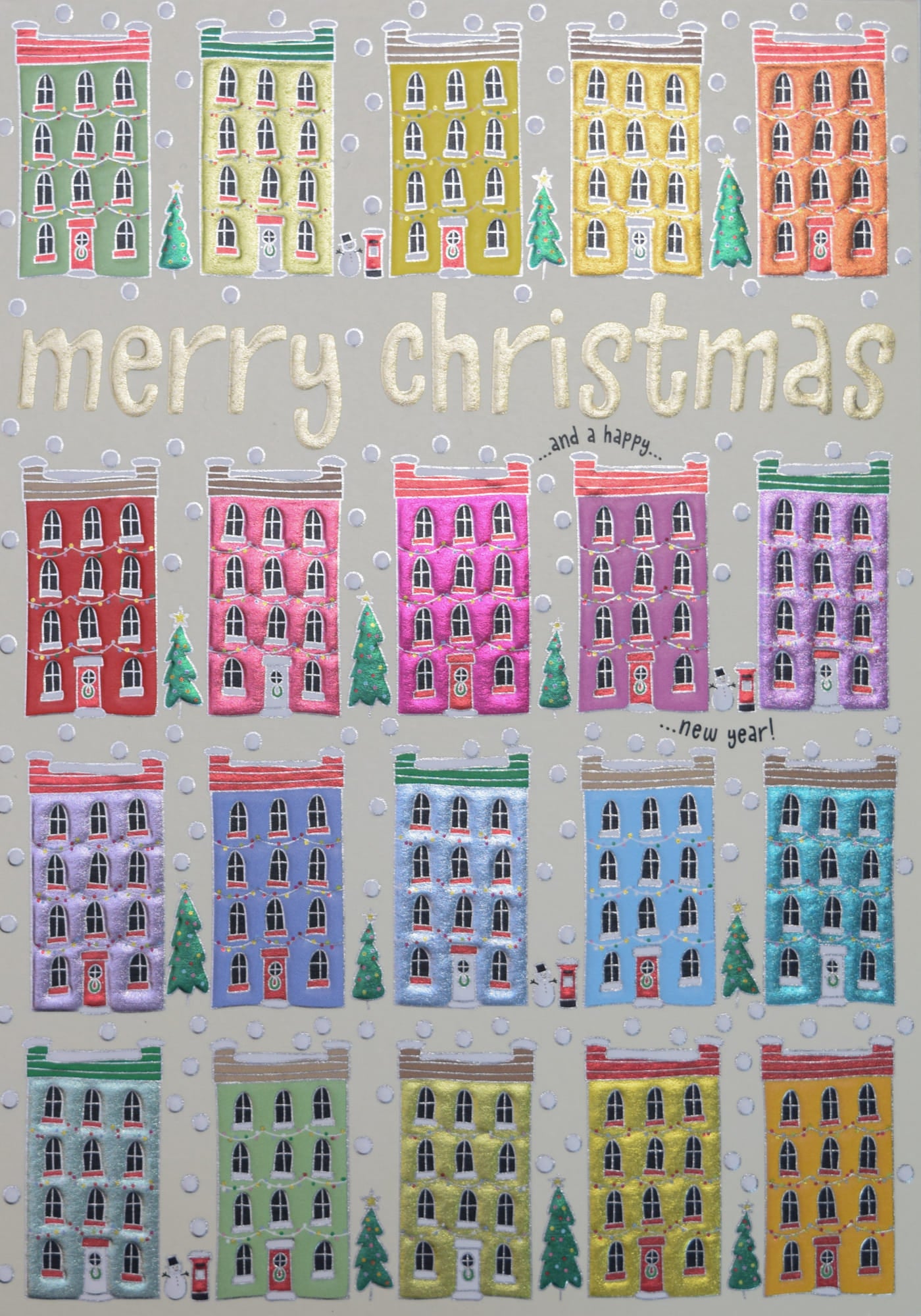 A handmade Christmas card featuring rows of colourful townhouses, with 'merry christmas' and 'and a happy new year' handwritten. 