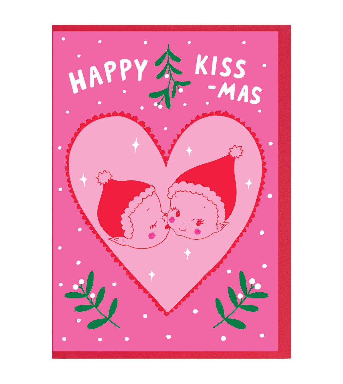A pink Christmas greeting card with the text 'HAPPY KISS -MAS' above a large heart-shaped illustration of two cherubs kissing, with green mistletoe branches and a small green tree.