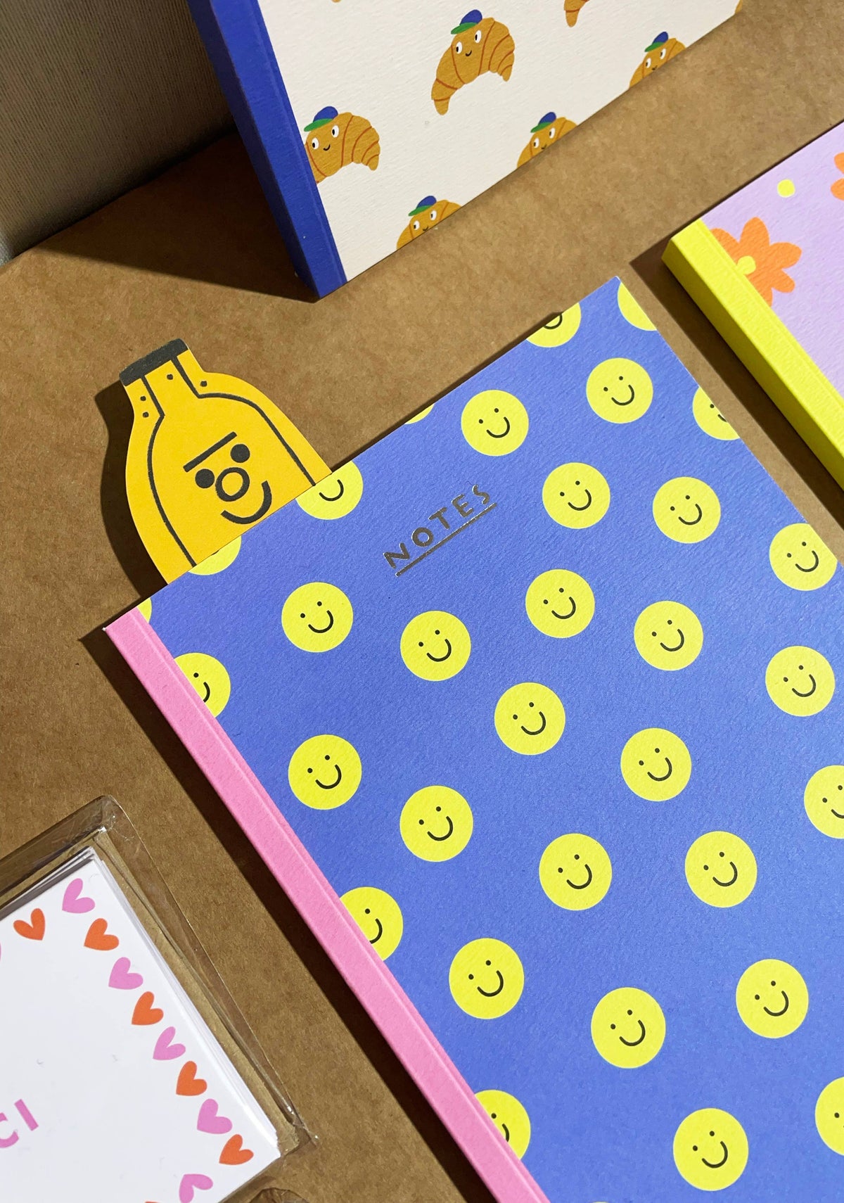 Jolly Banana Bookmark by penny black shown in use in a book